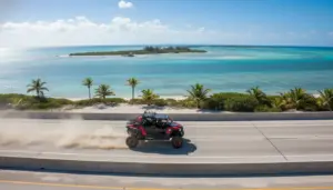 Polaris RZR UTV driving on the Overseas Highway in Florida Keys with turquoise water