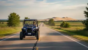 Michigan ATV UTV registration Polaris RZR on paved county road near Silver Lake dunes with Montana license plate