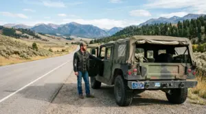 Surplus military HMMWV M1097 with Montana license plates on rural highway, HMMWV titling via Montana LLC guide